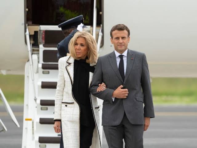 French Pres. Emmanuel Macron appeared to be pushed in the face by his wife Brigitte Macron as they arrived in Vietnam, the first stop of a Southeast Asia tour.